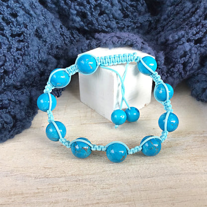 Pulsera turquesa bolas 8mm con macrame