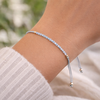 Pulsera topacio azul facetada bolas 2mm y macrame